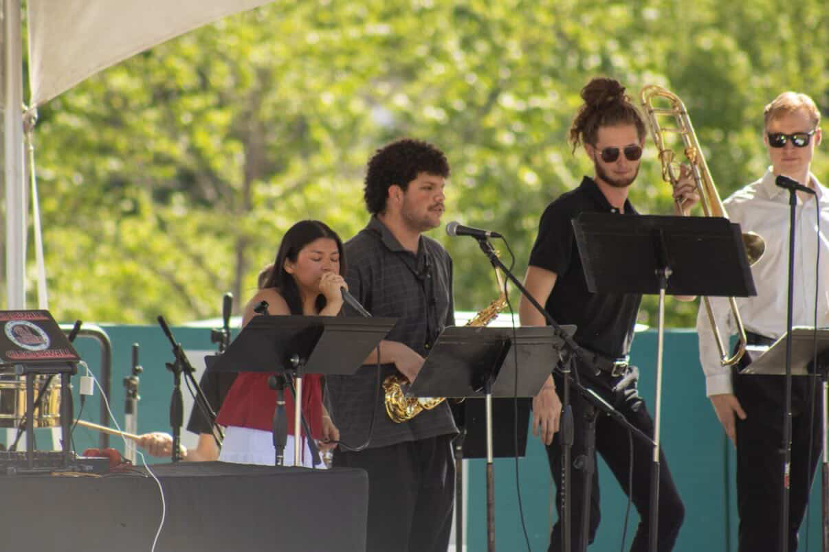 Orquesta Afinke horn section at a live performance